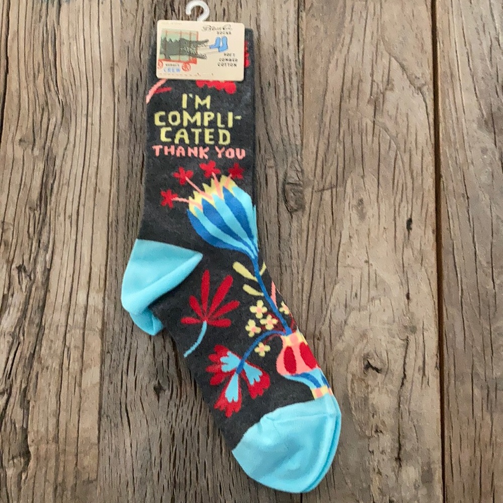Brand new unused gray socks with funny writing